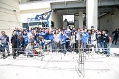 Civil engineering students participating at the ASCE Southeast Student Conference in Florida pose in front of a steel bridge model completed for on the Conference contests.